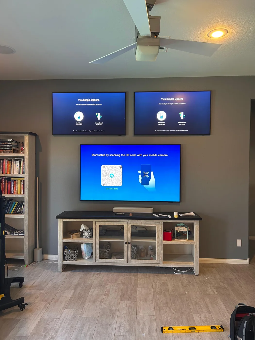 Three TVs mounted in a clean multi-display arrangement